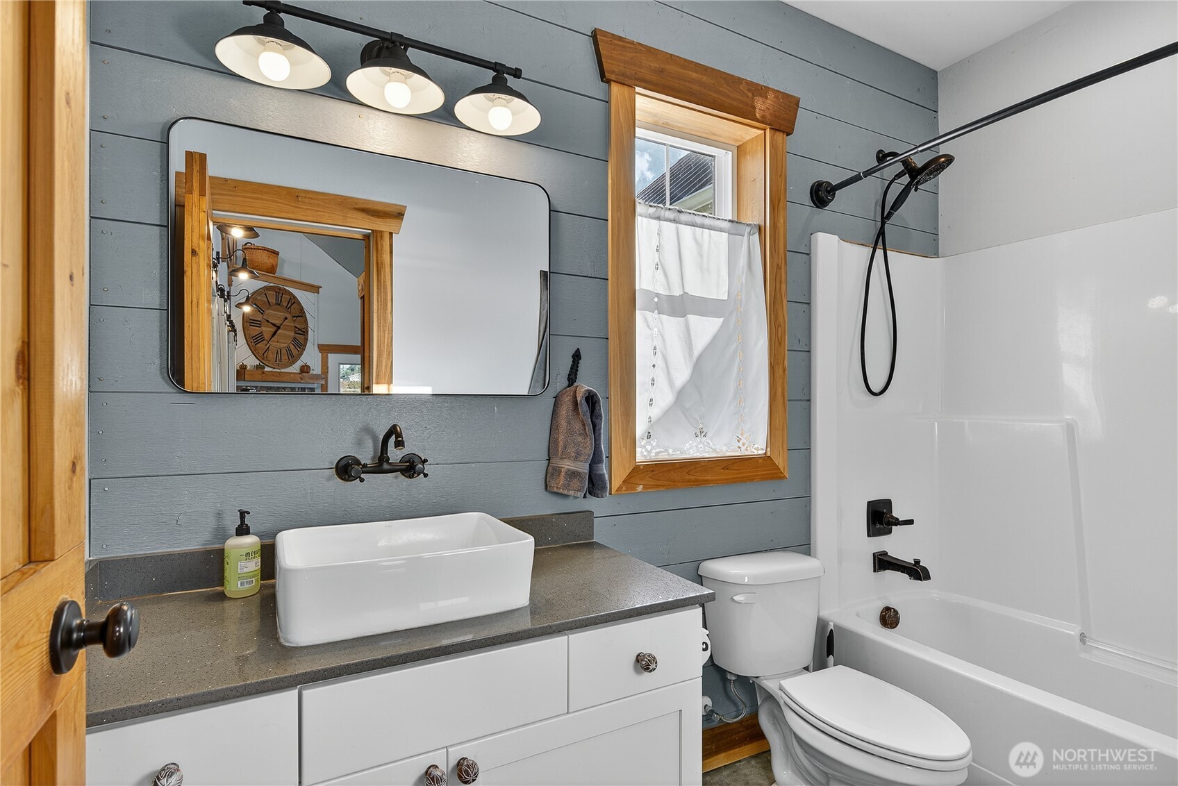 157 Russell Road Camano Island, WA 98282 - Photo 23 of 38 a bathroom with a sink a toilet and a bathtub