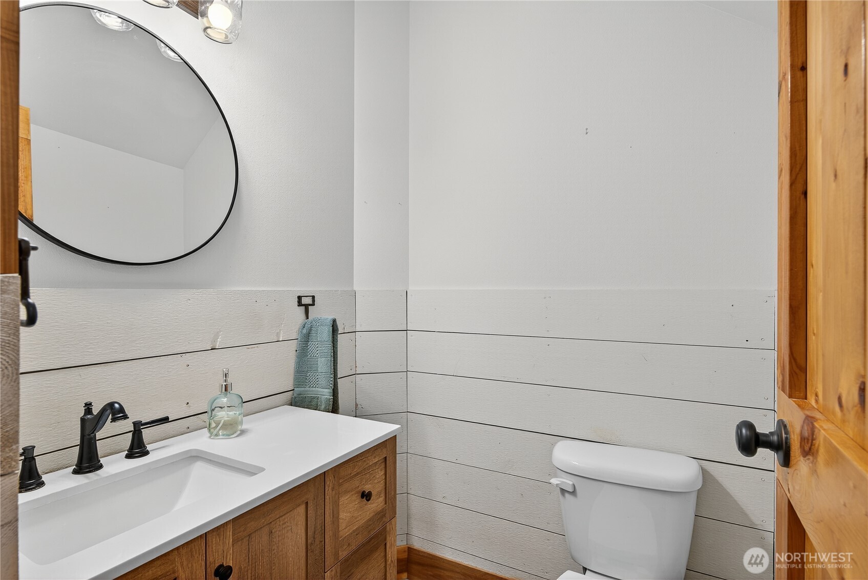 157 Russell Road Camano Island, WA 98282 - Photo 27 of 38 a bathroom with a sink and a mirror