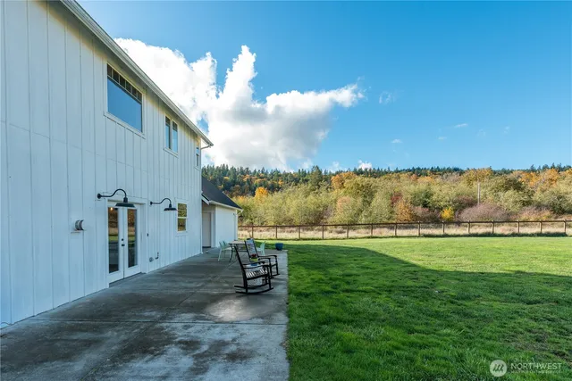 a front view of house with yard and outdoor seating