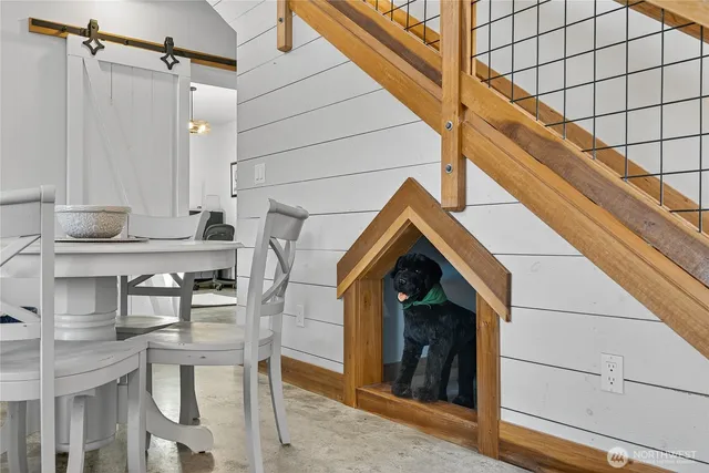 a view of a dining room with furniture and wooden floor