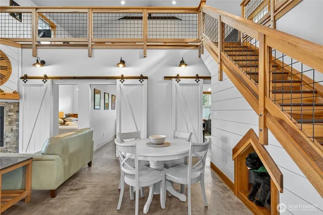 a large kitchen with kitchen island a large counter top space a sink and stainless steel appliances