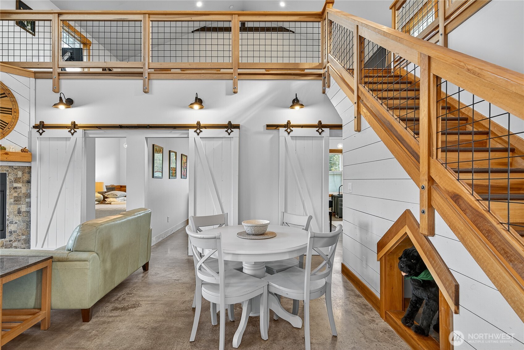 157 Russell Road Camano Island, WA 98282 - Photo 9 of 38 a view of a dining room with furniture and wooden floor