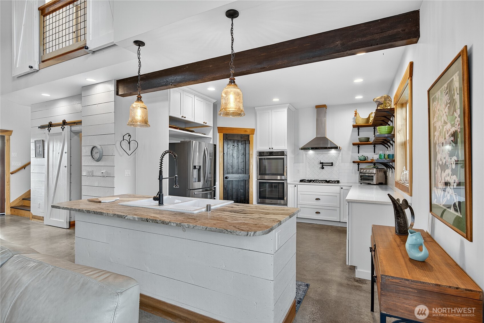157 Russell Road Camano Island, WA 98282 - Photo 10 of 38 a large kitchen with kitchen island a large counter top space a sink and stainless steel appliances