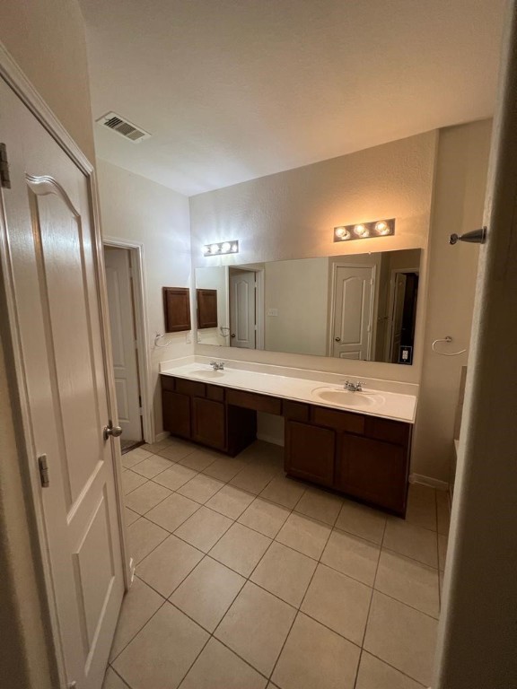 411 Stream Mill Lane Katy, TX 77494 - Photo 12 of 29 a bathroom with a double vanity sink mirror and bathtub