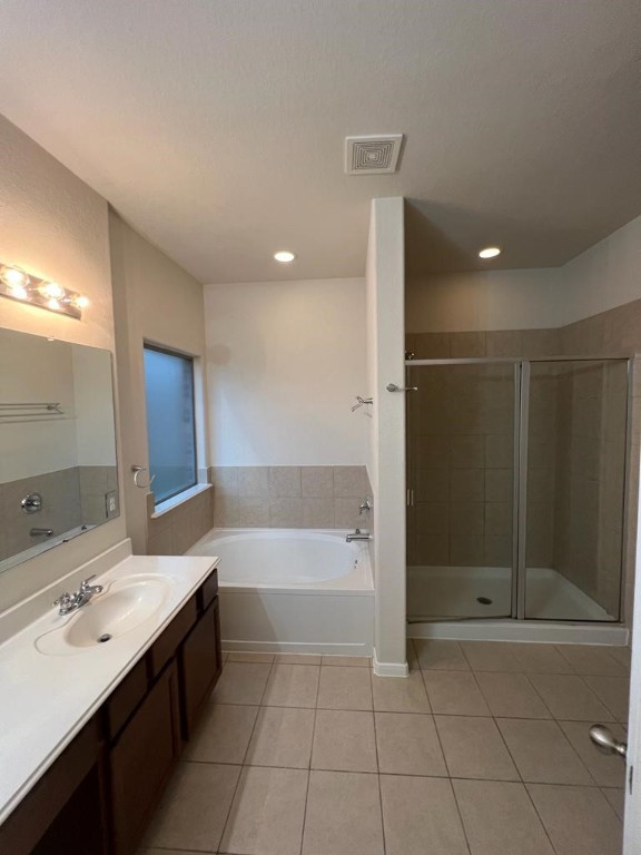 411 Stream Mill Lane Katy, TX 77494 - Photo 14 of 29 a bathroom with a bathtub and a sink