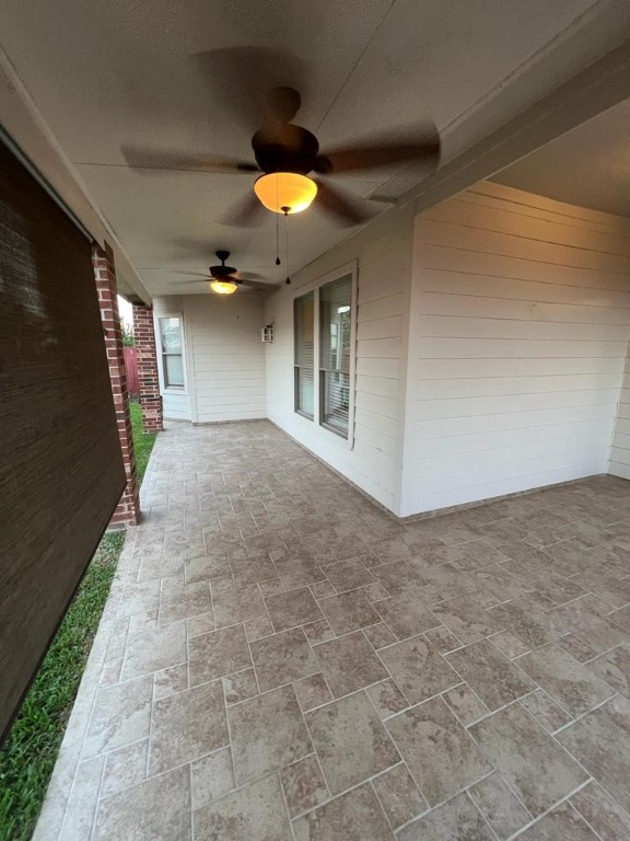 411 Stream Mill Lane Katy, TX 77494 - Photo 19 of 29 a view of a hallway with a chandelier