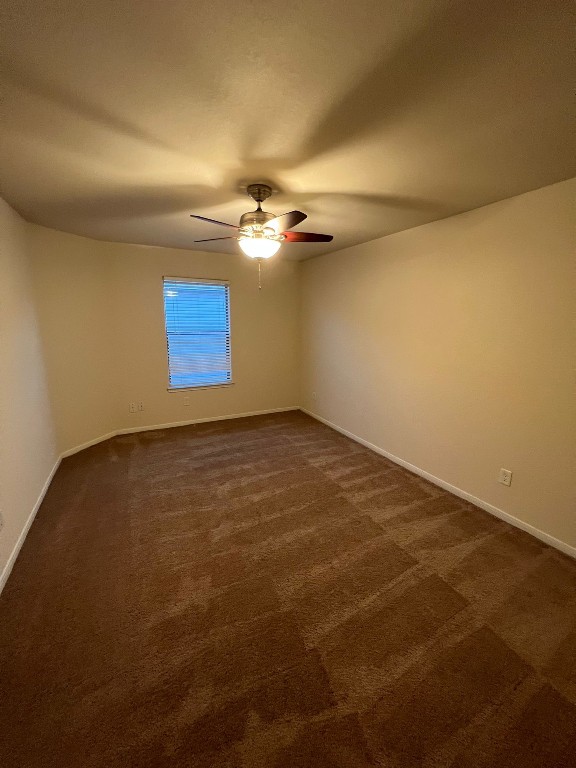 411 Stream Mill Lane Katy, TX 77494 - Photo 26 of 29 an empty room with a ceiling fan and window