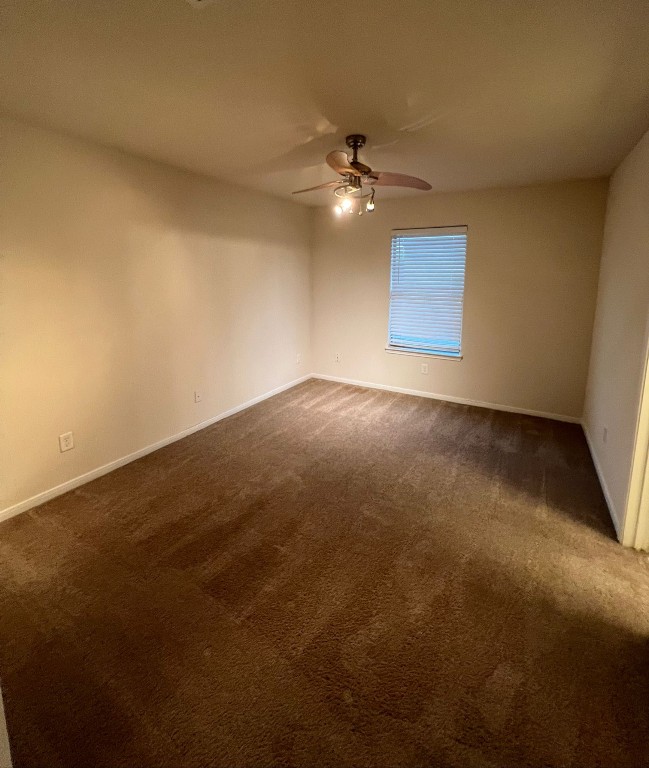 411 Stream Mill Lane Katy, TX 77494 - Photo 29 of 29 an empty room with a ceiling fan and fan