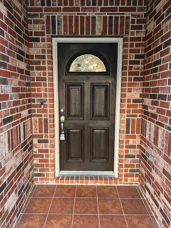 411 Stream Mill Lane Katy, TX 77494 - Photo 4 of 29 a view of a wooden door of a building