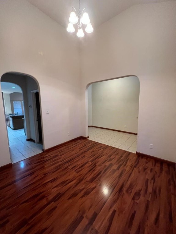 411 Stream Mill Lane Katy, TX 77494 - Photo 5 of 29 a view of an empty room with wooden floor and a window