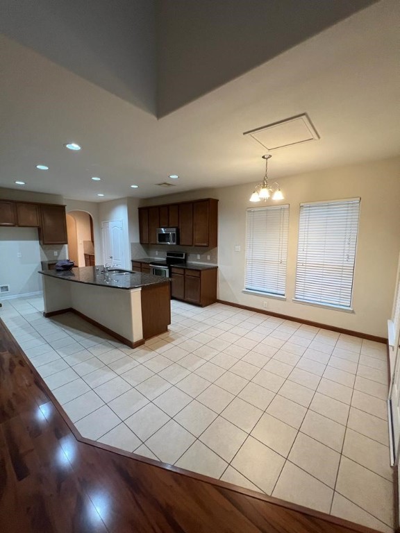411 Stream Mill Lane Katy, TX 77494 - Photo 8 of 29 a large kitchen with kitchen island granite countertop a large counter top stainless steel appliances and cabinets