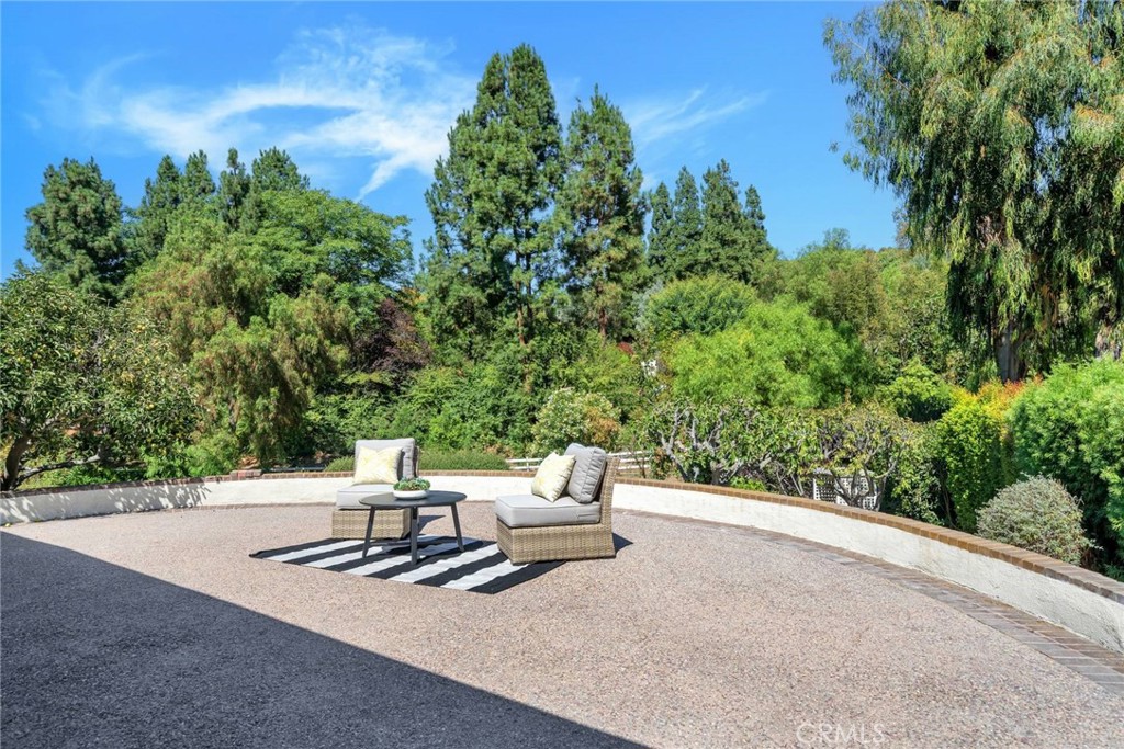 5203 Middlecrest Road Rancho Palos Verdes, CA 90275 - Photo 15 of 28 a white bench sitting in the middle of a yard