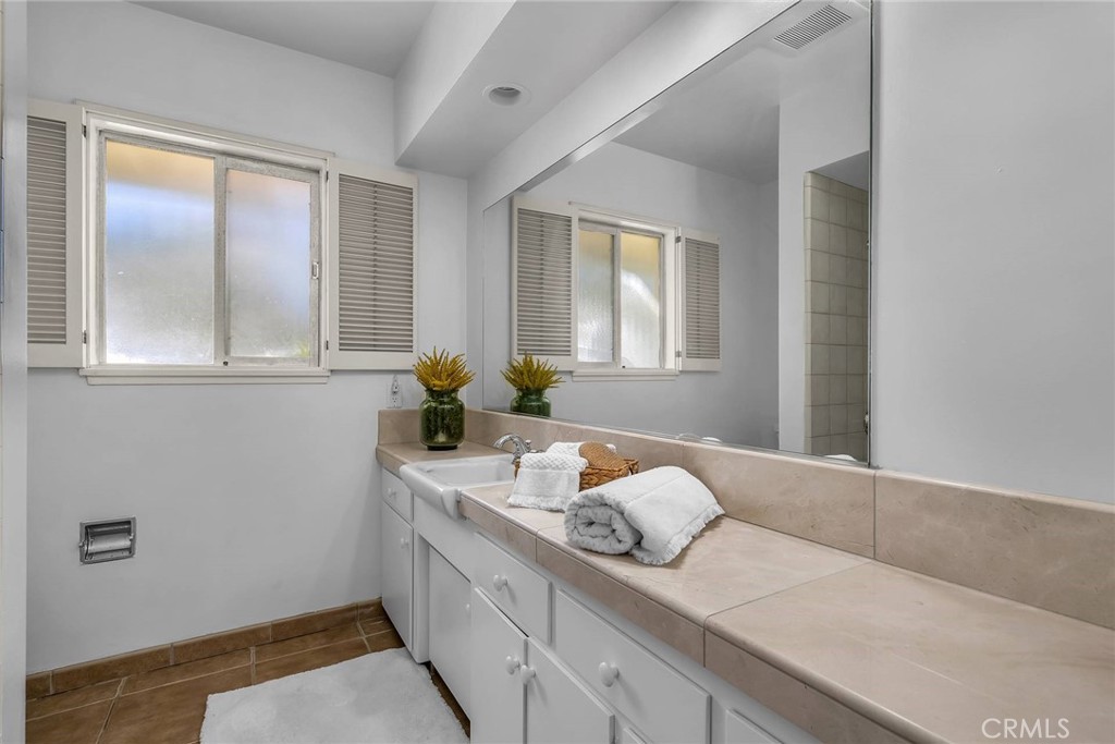 5203 Middlecrest Road Rancho Palos Verdes, CA 90275 - Photo 19 of 28 a bathroom with a sink and a mirror