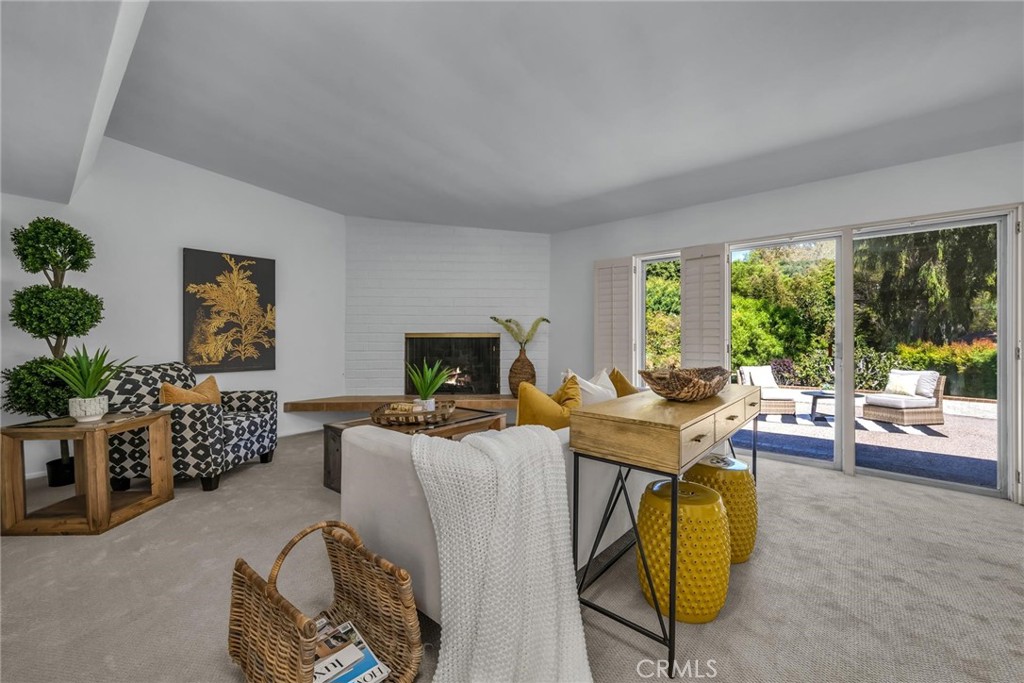 5203 Middlecrest Road Rancho Palos Verdes, CA 90275 - Photo 3 of 28 a living room with furniture and a flat screen tv