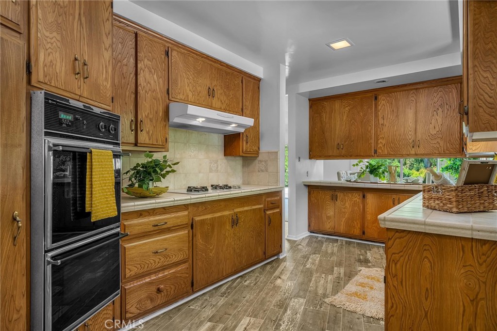 5203 Middlecrest Road Rancho Palos Verdes, CA 90275 - Photo 10 of 28 a kitchen with stainless steel appliances granite countertop a refrigerator and a stove