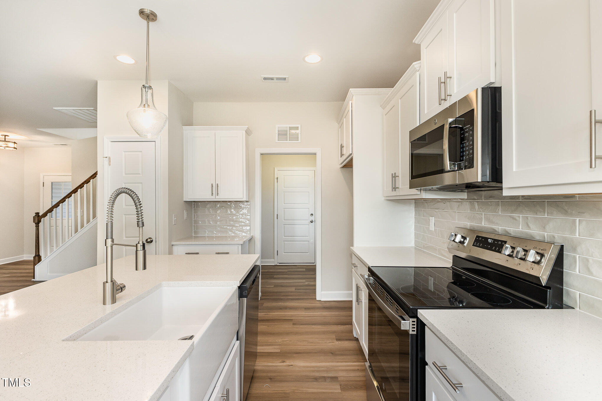 15 Barony Lane Smithfield, NC 27577 - Photo 11 of 24 a kitchen with stainless steel appliances a stove microwave and cabinets