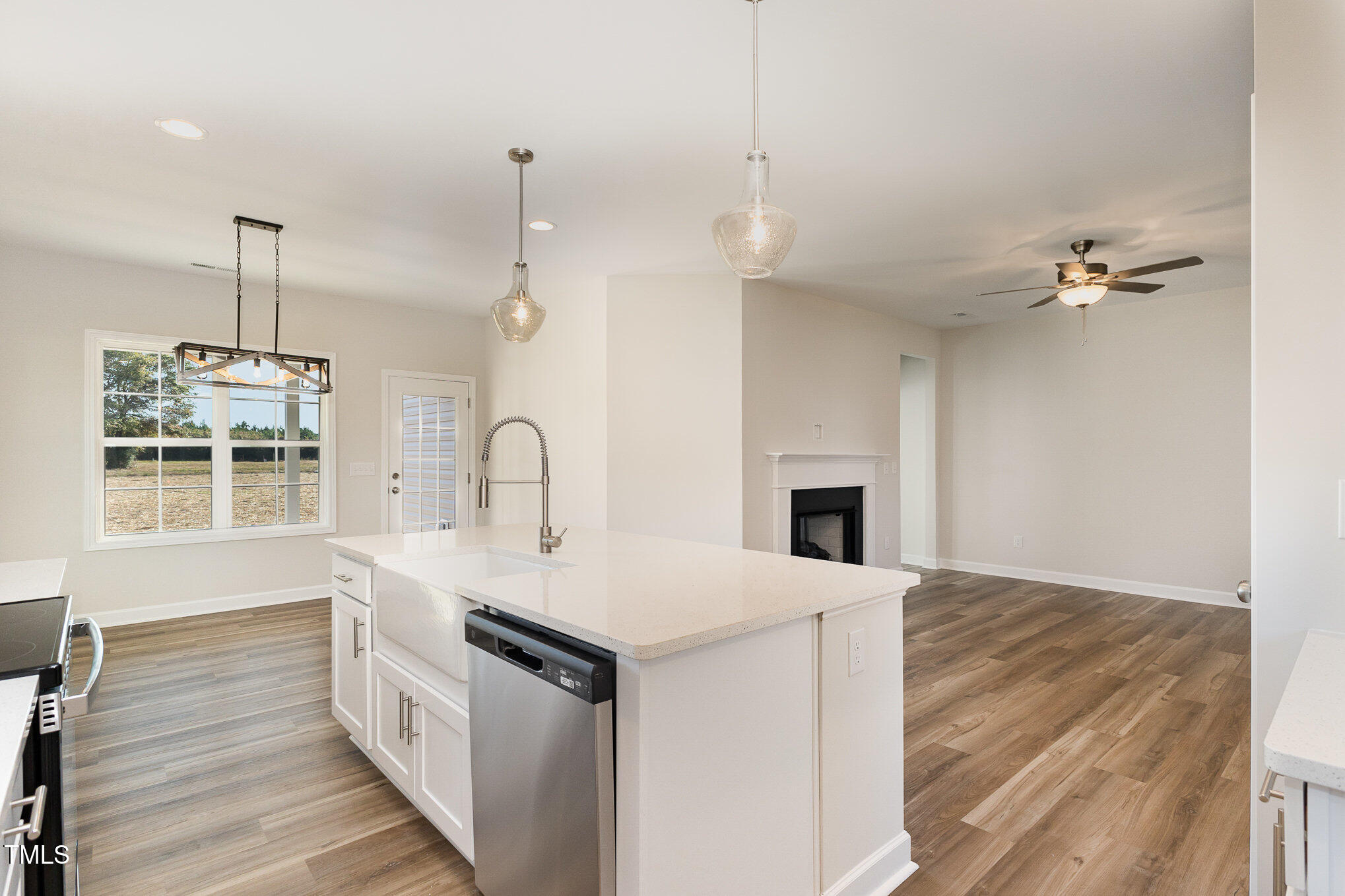 15 Barony Lane Smithfield, NC 27577 - Photo 9 of 24 a kitchen with a sink appliances and wooden floor