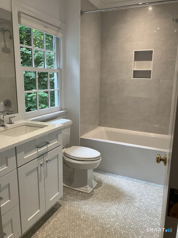 9 Tory Hole Road Darien, CT 06820 - Photo 25 of 33 a bathroom with a sink a toilet and a bathtub