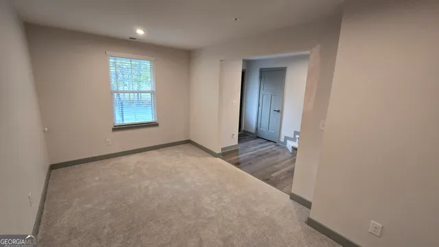 a view of a car park in front of house