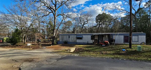 a view of a backyard of the house