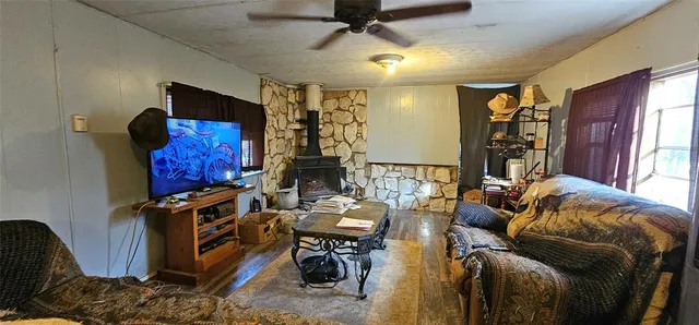 a view of a dining room with furniture and a window