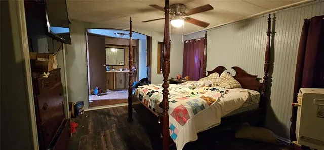 a bathroom with a sink a mirror and a shower