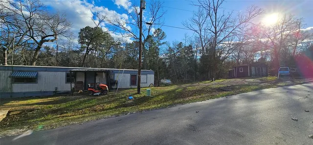 a view of street with large trees