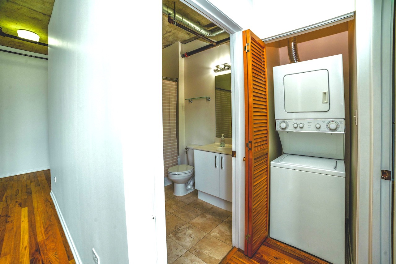 700 West Van Buren Street, Unit 1010 Chicago, IL 60607 - Photo 9 of 12 a bathroom with a sink and a mirror