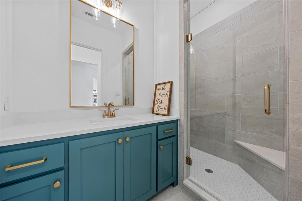 216 Wycliff Drive China Spring, TX 76633 - Photo 23 of 40 a bathroom with a shower sink and mirror