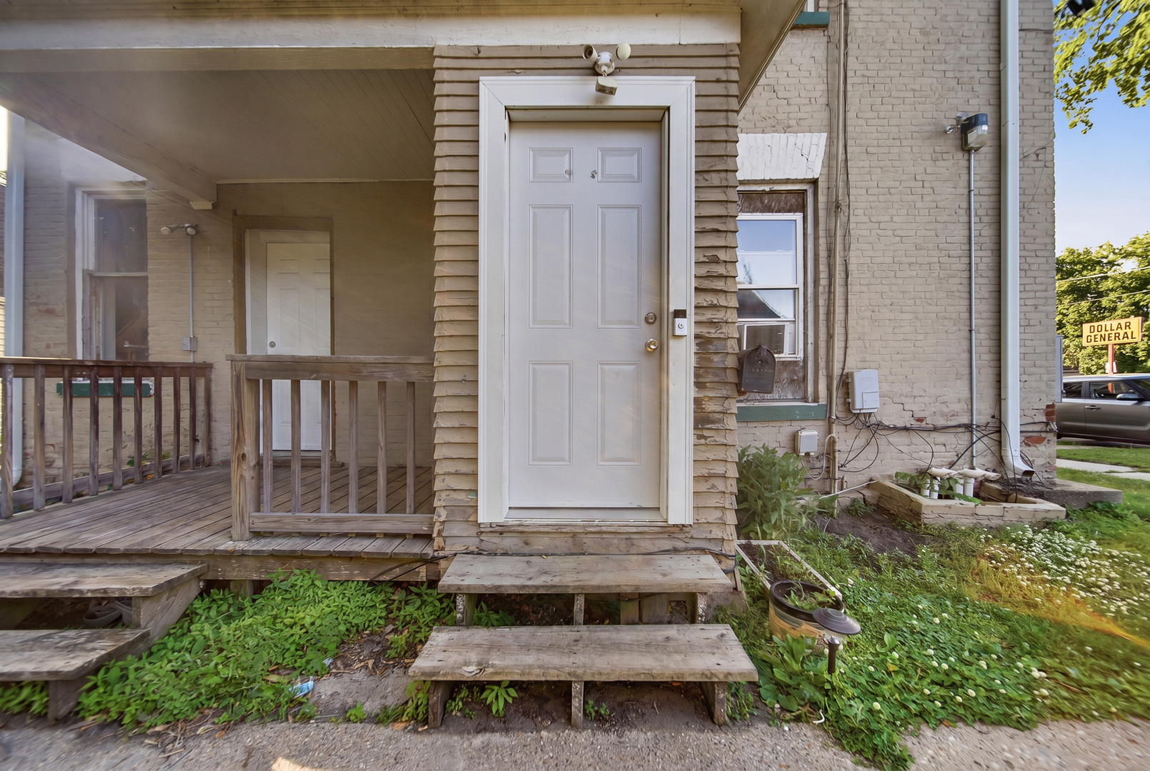 305 Monroe Avenue Dixon, IL 61021 - Photo 7 of 36 a view of a house with a small yard and wooden floor and fence