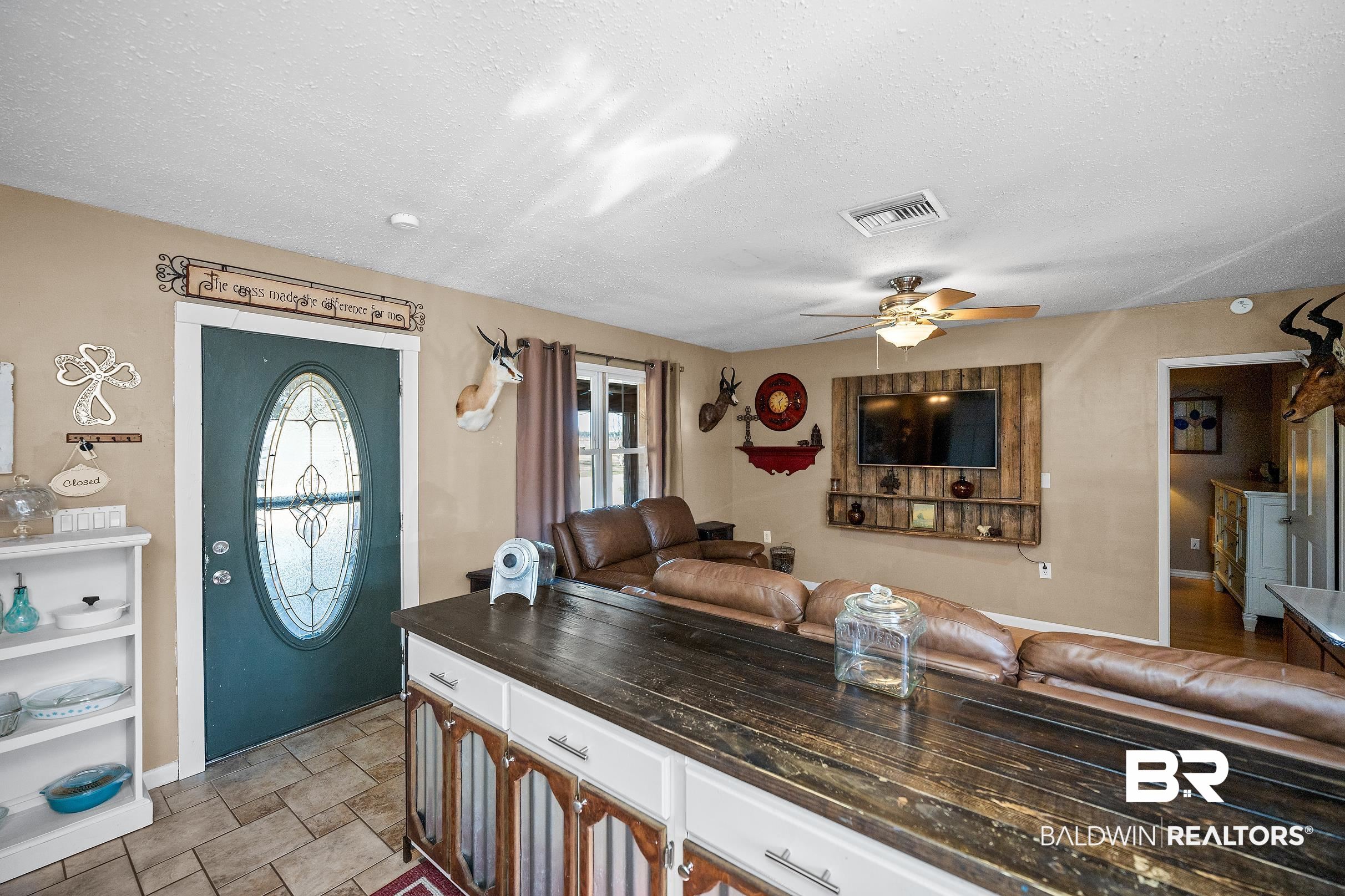 110 Sam Jones Road Atmore, AL 36502 - Photo 20 of 47 Foyer featuring a textured ceiling and a ceiling fan
