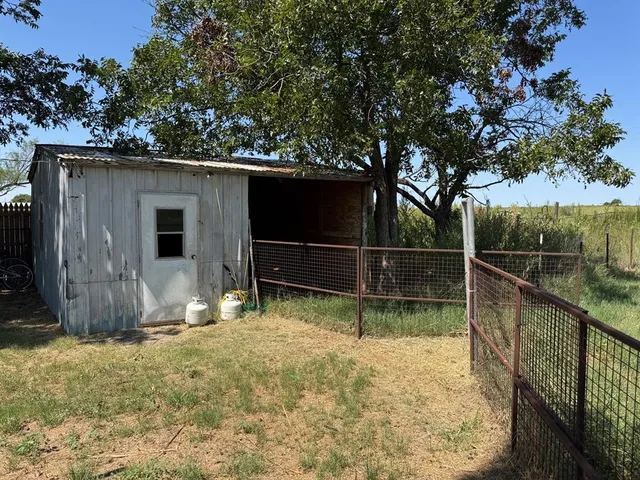 a view of backyard with green space