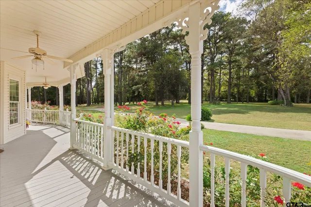 a view of a livingroom with fireplace wooden floor and staircase