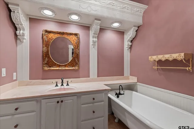a view of a hallway with wooden floor and door