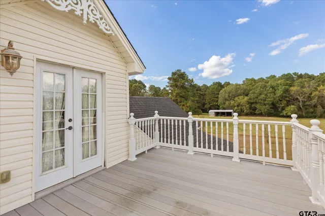 a view of a patio with chairs and a potted plant