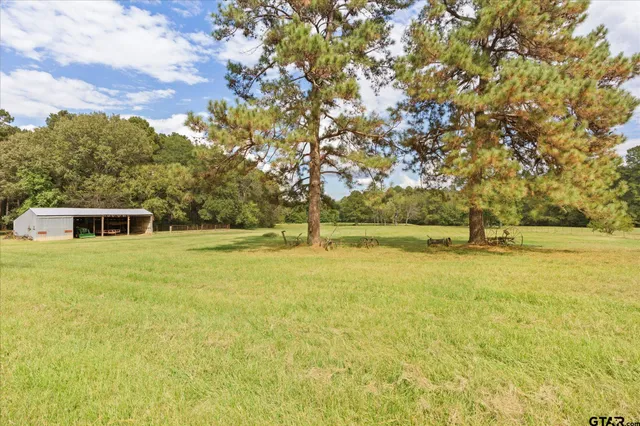 a view of swimming pool with an outdoor seating