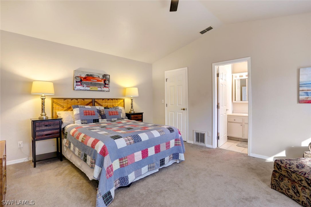 13710 Raleigh Lane, Unit 5 Fort Myers, FL 33919 - Photo 11 of 29 a bedroom with a bed and a cabinets