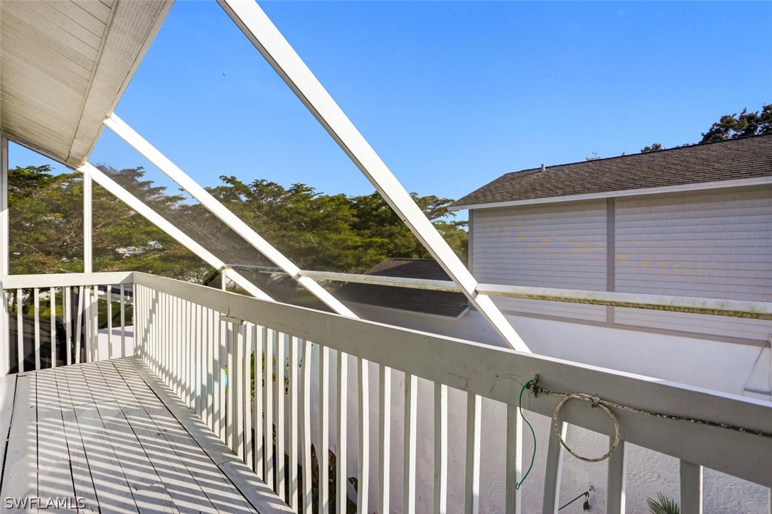 13710 Raleigh Lane, Unit 5 Fort Myers, FL 33919 - Photo 14 of 29 a view of balcony with wooden floor and fence