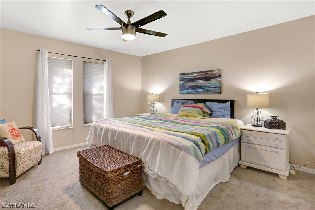 13710 Raleigh Lane, Unit 5 Fort Myers, FL 33919 - Photo 15 of 29 a bedroom with a bed and window