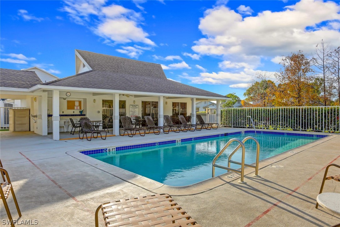 13710 Raleigh Lane, Unit 5 Fort Myers, FL 33919 - Photo 2 of 29 a view of a house with swimming pool and sitting area