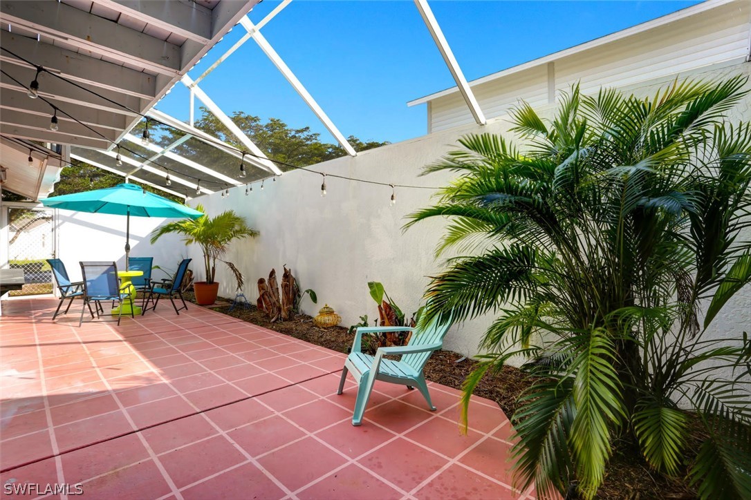 13710 Raleigh Lane, Unit 5 Fort Myers, FL 33919 - Photo 22 of 29 a view of a backyard with a patio