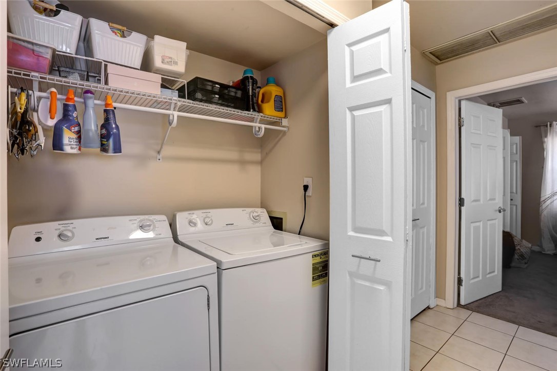 13710 Raleigh Lane, Unit 5 Fort Myers, FL 33919 - Photo 24 of 29 a utility room with dryer and washer
