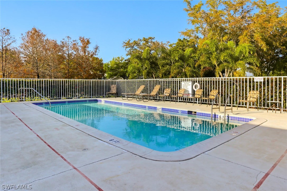 13710 Raleigh Lane, Unit 5 Fort Myers, FL 33919 - Photo 27 of 29 a view of a swimming pool with a balcony