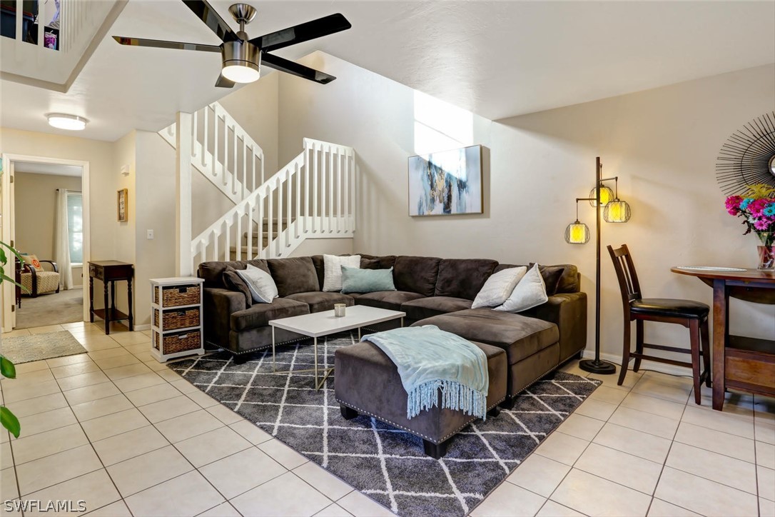 13710 Raleigh Lane, Unit 5 Fort Myers, FL 33919 - Photo 3 of 29 a living room with furniture a table and chairs