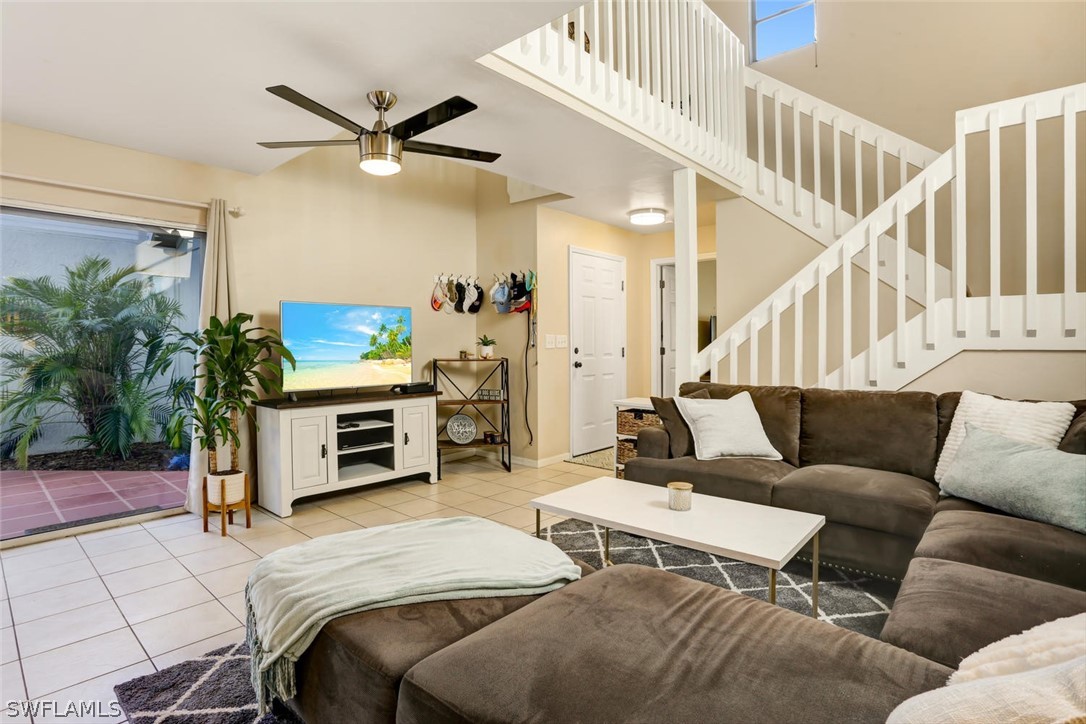 13710 Raleigh Lane, Unit 5 Fort Myers, FL 33919 - Photo 5 of 29 a living room with furniture and a flat screen tv