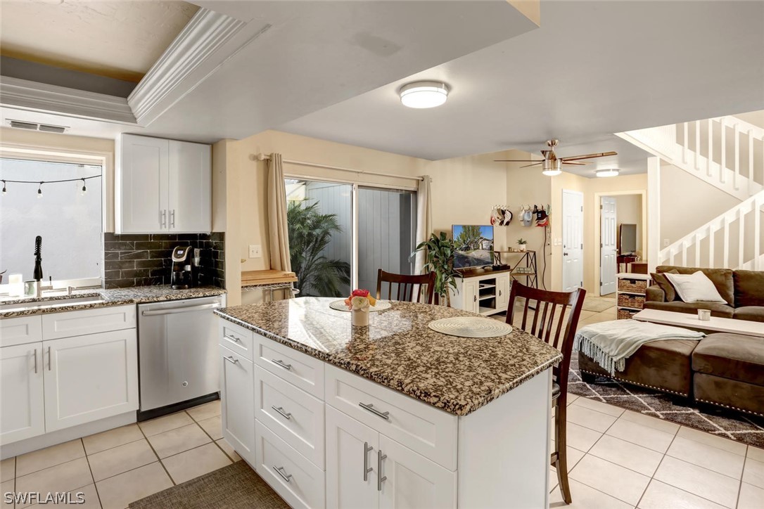 13710 Raleigh Lane, Unit 5 Fort Myers, FL 33919 - Photo 8 of 29 a kitchen with sink and refrigerator