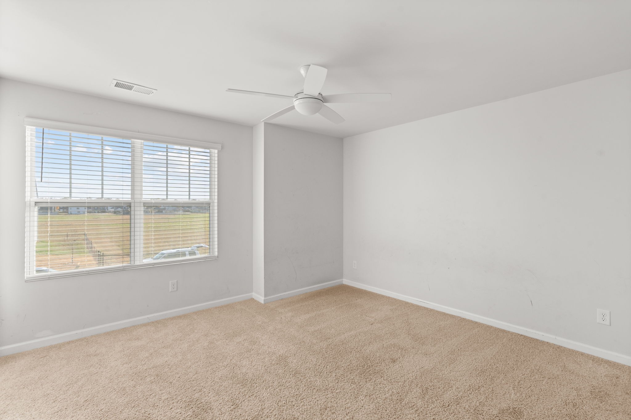 230 Willy Mae Road Murfreesboro, TN 37129 - Photo 18 of 23 an empty room with a window and ceiling fan