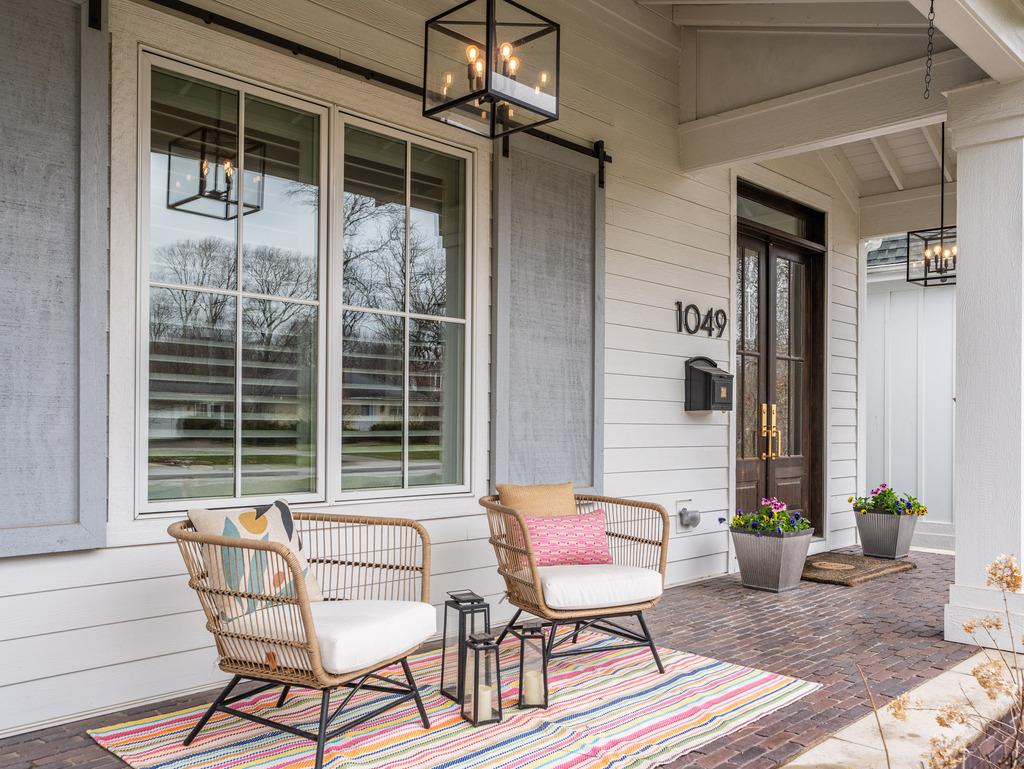 1049 Sylvan Circle Naperville, IL 60540 - Photo 2 of 3 a balcony with furniture and a potted plant