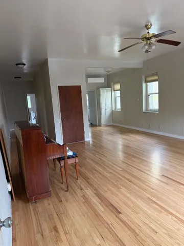 a view of a livingroom with furniture and wooden floor