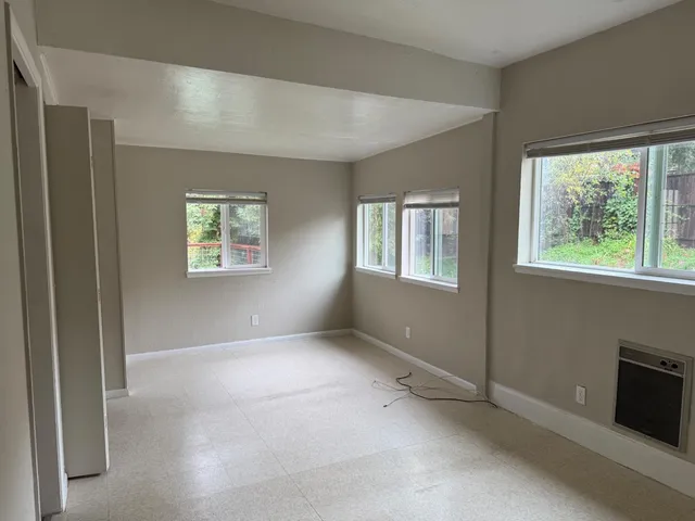 an empty room with windows